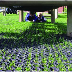 Black recycled rubber matting laid as a slip-resistant surface on a ramp