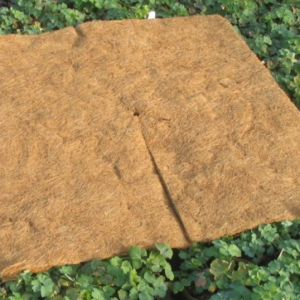 Biodegradable coir mulch mat fitted around the base of a tree