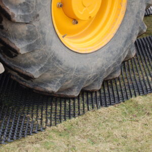 Black HDPE Trackguard mesh panel laid on grass for vehicle access