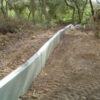 Herpetosure newt and slow worm fencing panels installed along a site boundary