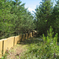 Herpetosure snake fencing panel fitted along a boundary trench, 900mm above ground